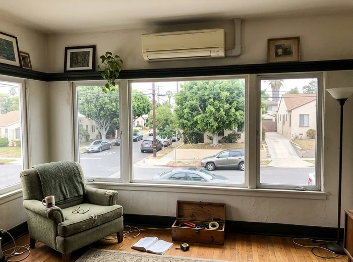 Slim indoor head installed above original trim in a pre-1960 bungalow