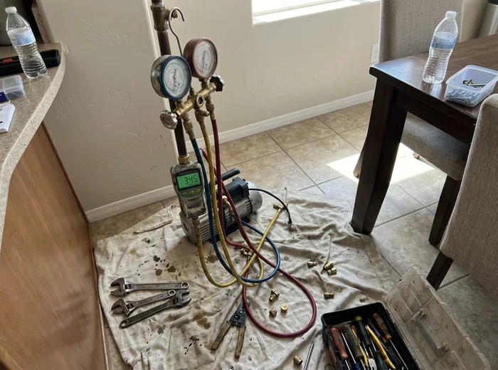 Micron gauge reading during system evacuation before charging