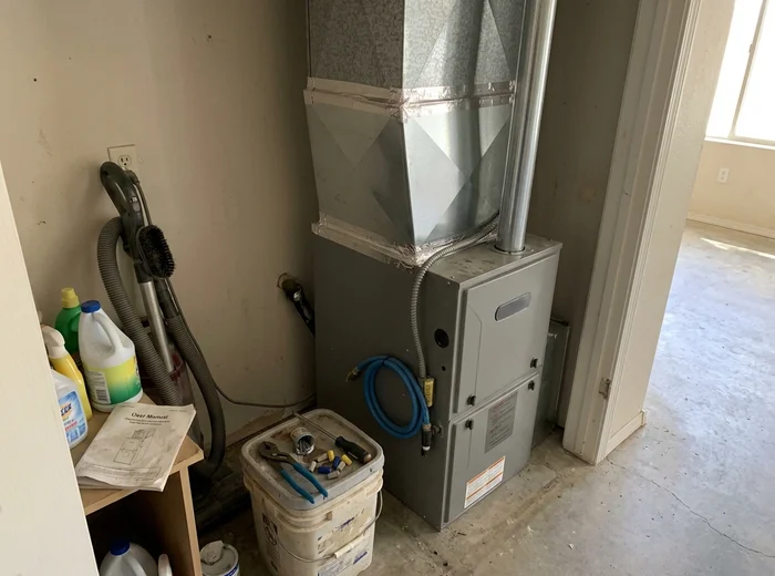 New furnace set in place with fabricated sheet metal transitions